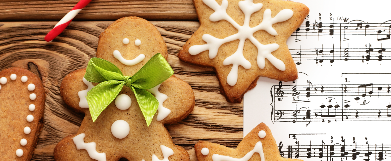 ginger bread cookies and music sheets on wood table